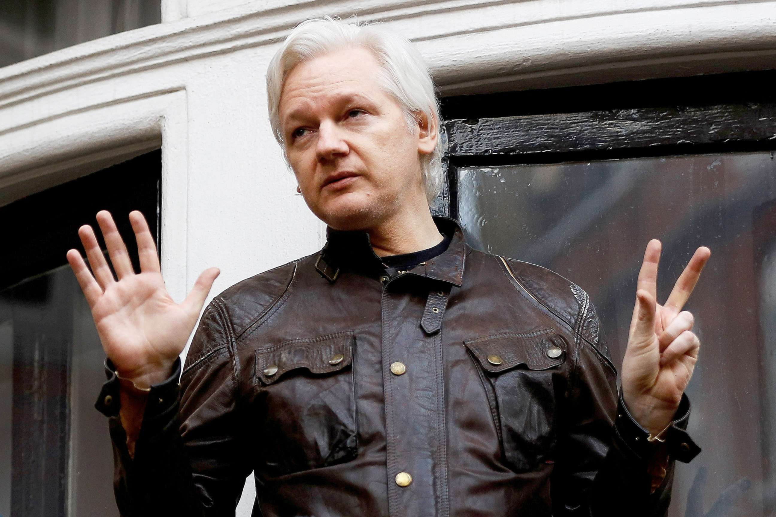 PHOTO: WikiLeaks founder Julian Assange is seen on the balcony of the Ecuadorian Embassy in London, May 19, 2017. 