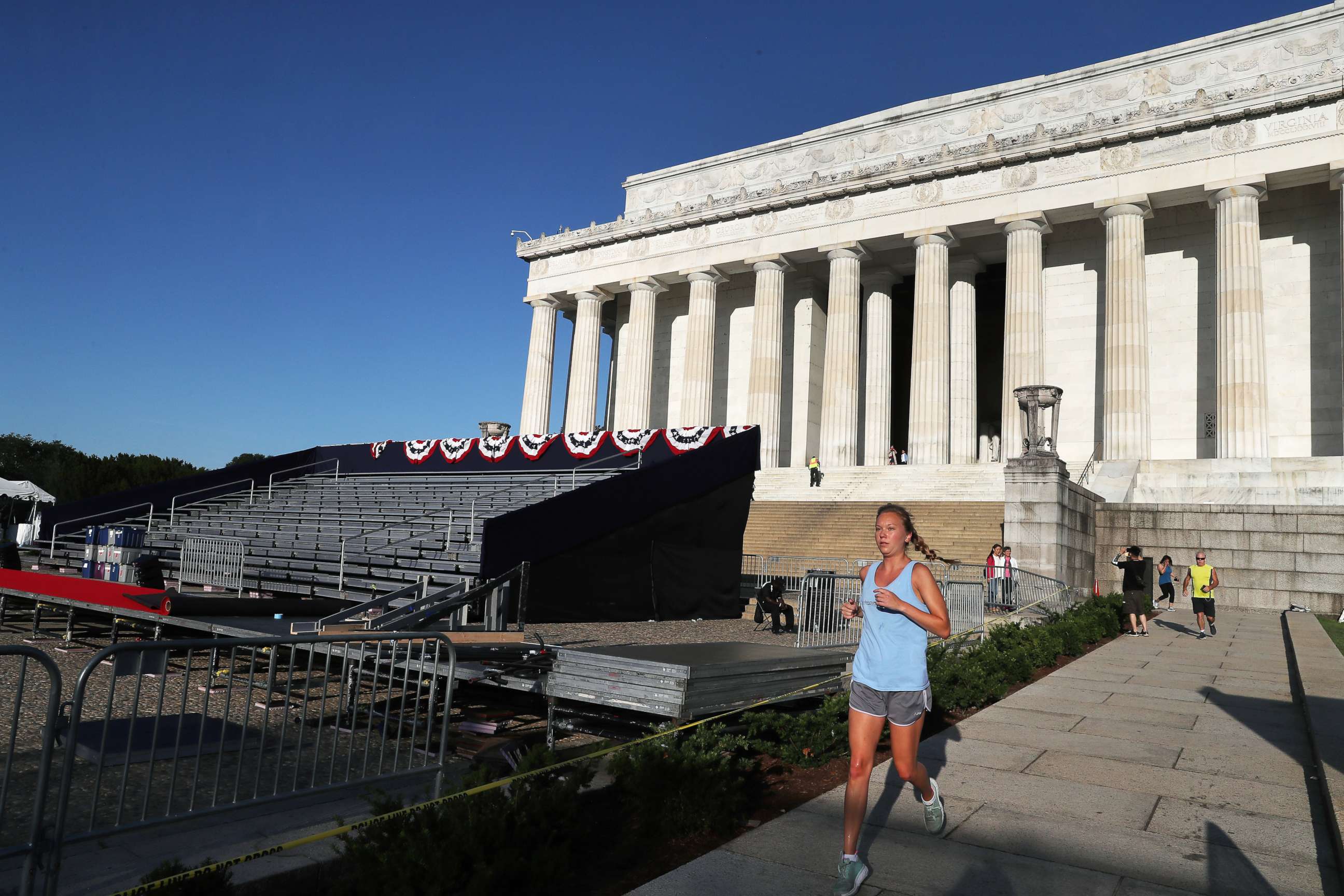PHOTO: A jogger runs past the Lincoln Memorial ahead of the "July 4th Salute to America" celebration, July 2, 2019, in Washington, D.C.