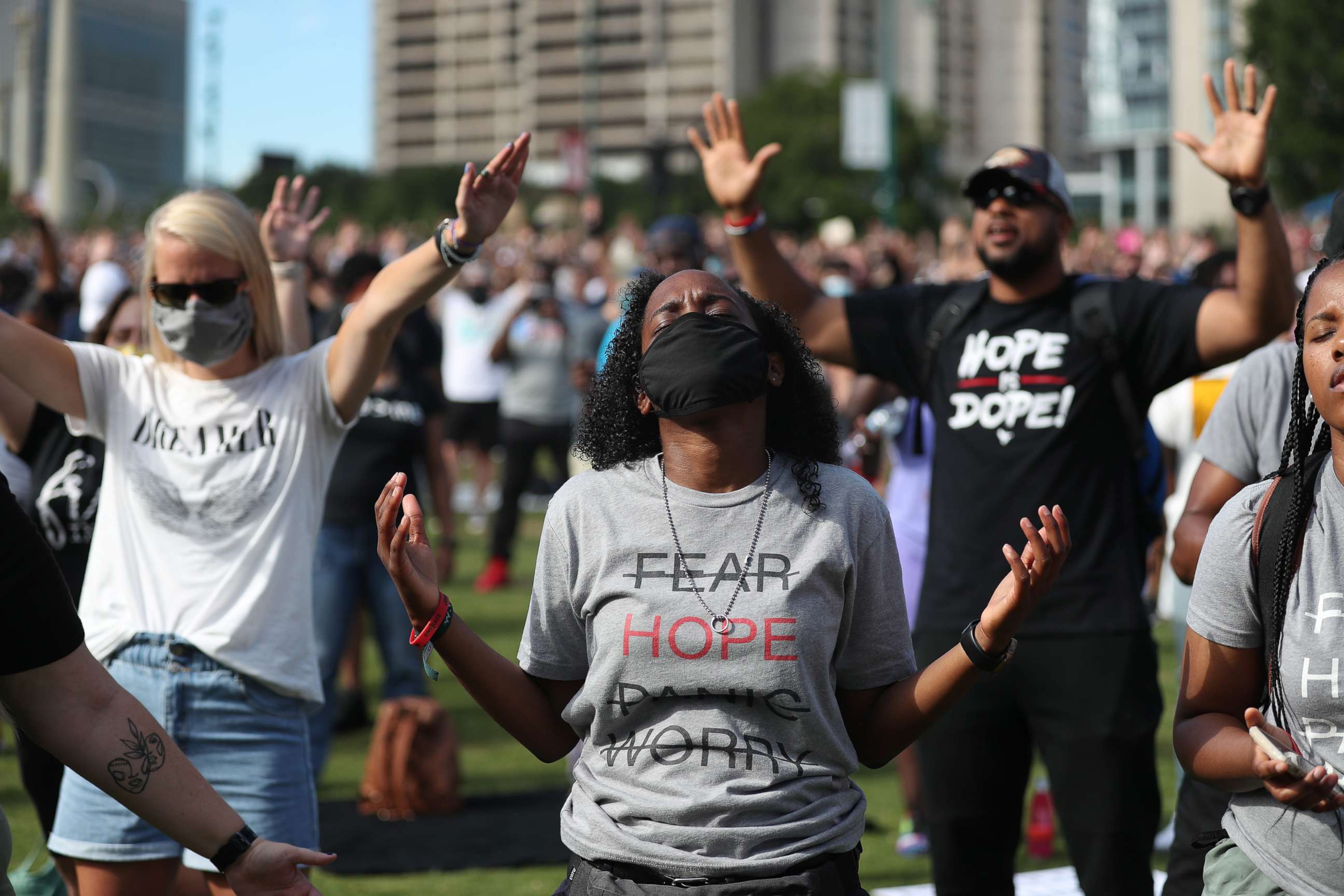 PHOTO: People pray together during a Juneteenth event at Centennial Olympic Park on June 19, 2020, in Atlanta.