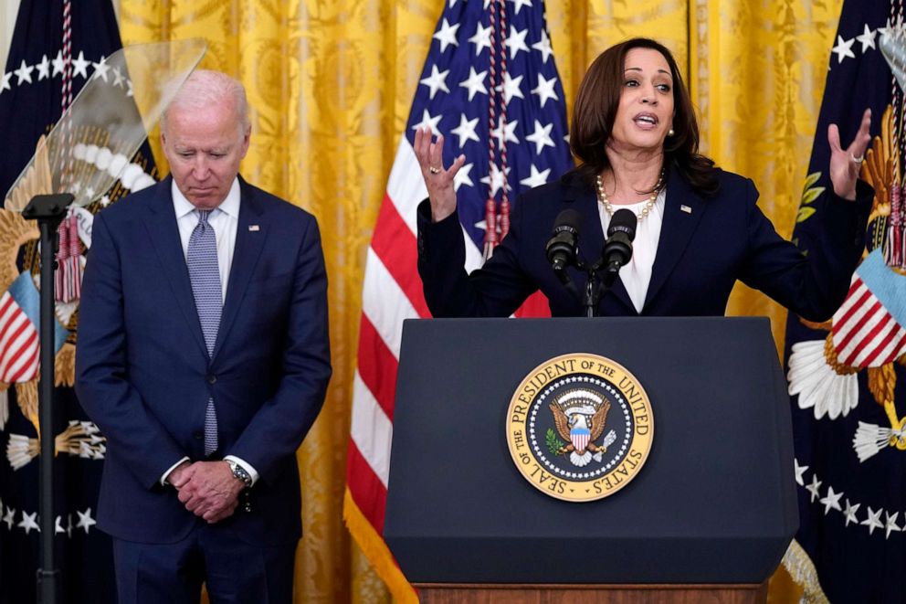 PHOTO: President Joe Biden listens as Vice President Kamala Harris speaks during an event to mark the passage of the Juneteenth National Independence Day Act, in the East Room of the White House, June 17, 2021.