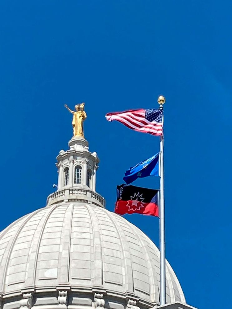 PHOTO: The flag marking the Juneteenth holiday flies over the Wisconsin state Capitol after being raised on June 18, 2021, in Madison, Wis.
