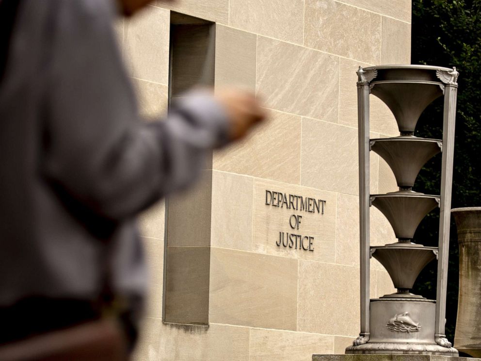PHOTO: A pedestrians walks past the U.S. Department of Justice (DOJ) headquarters in Washington, D.C., Aug. 15, 2019.
