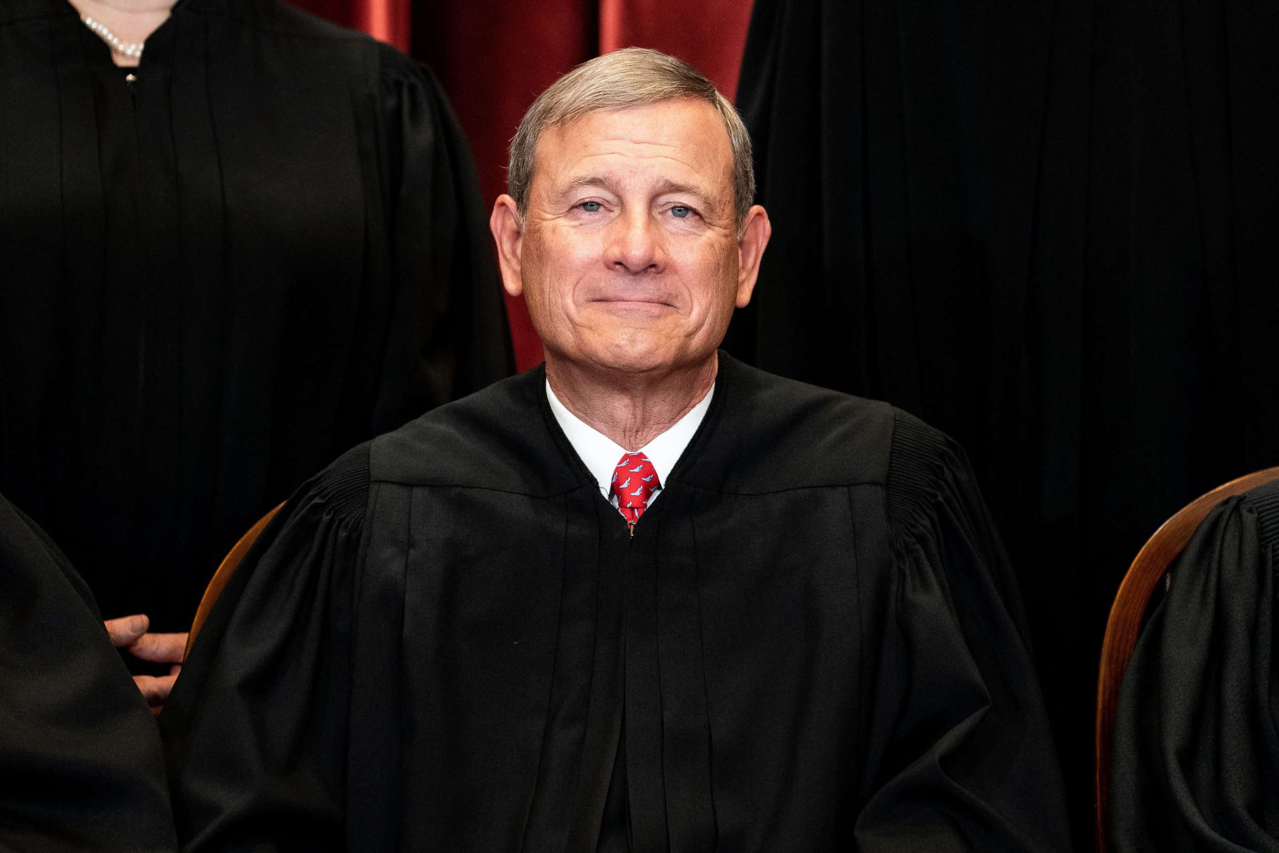 PHOTO: Chief Justice John Roberts sits during a group photo of the Justices at the Supreme Court in Washington, DC, April 23, 2021.