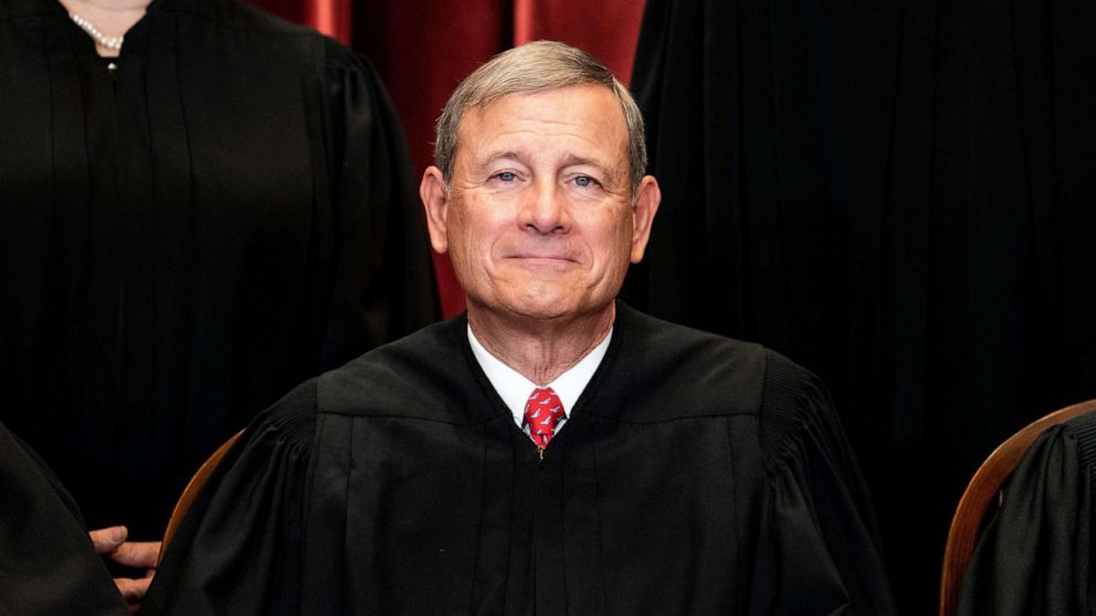 PHOTO: Chief Justice John Roberts sits during a group photo of the Justices at the Supreme Court in Washington, DC, April 23, 2021.