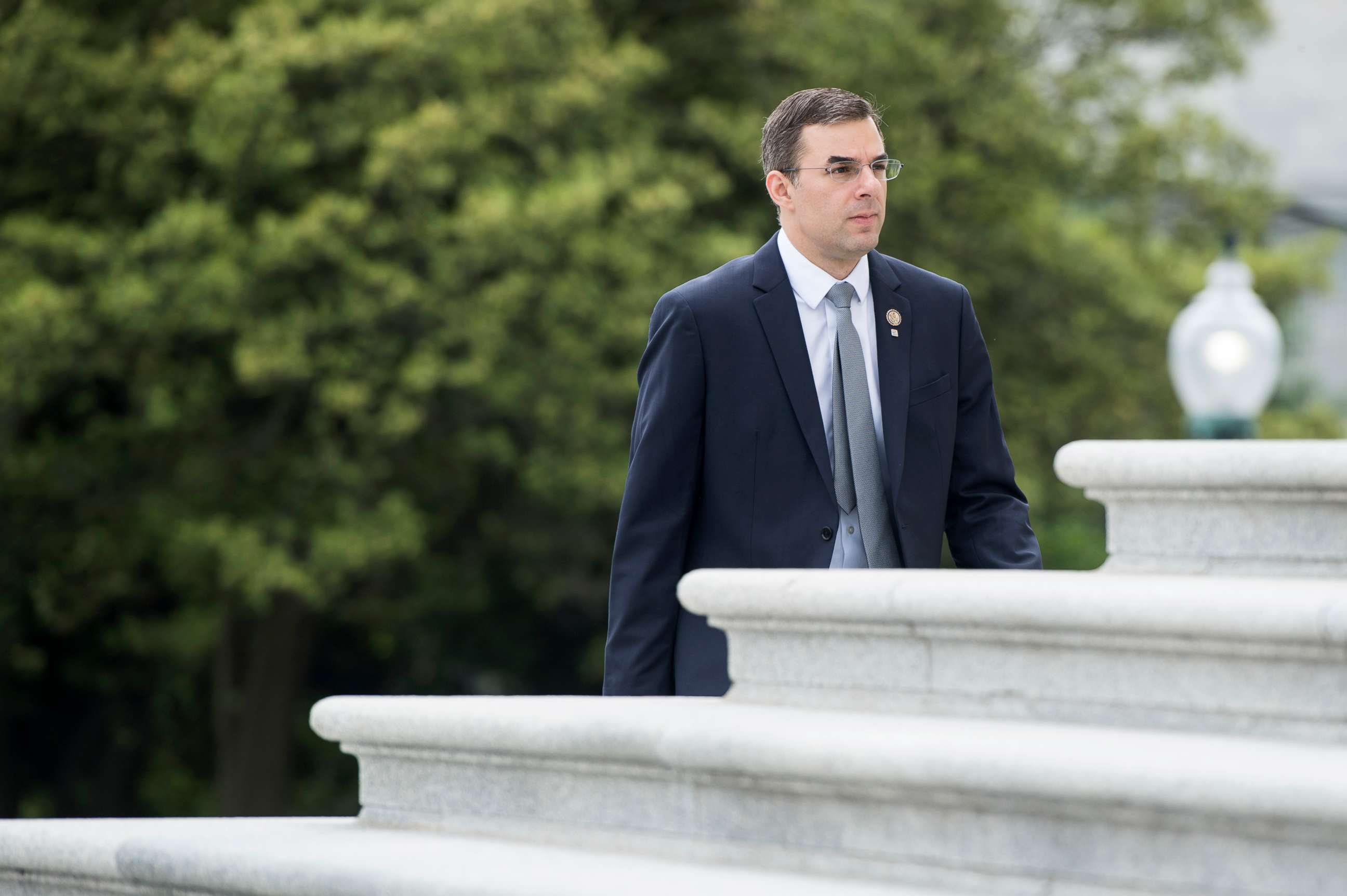PHOTO: Rep. Justin Amash walks up the House steps for a vote in the Capitol, May 9, 2019, in Washington, DC.