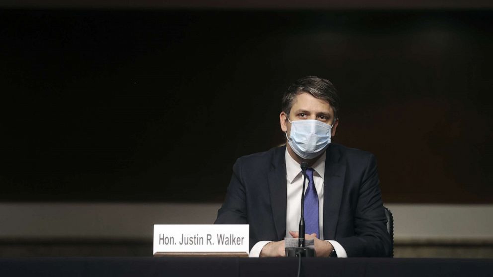 PHOTO: Judge Justin Walker wears a protective face mask as he sits in a sparsely attended hearing room due to social distancing measures because of the COVID-19 outbreak, during a hearing on his nomination, May 6, 2020.