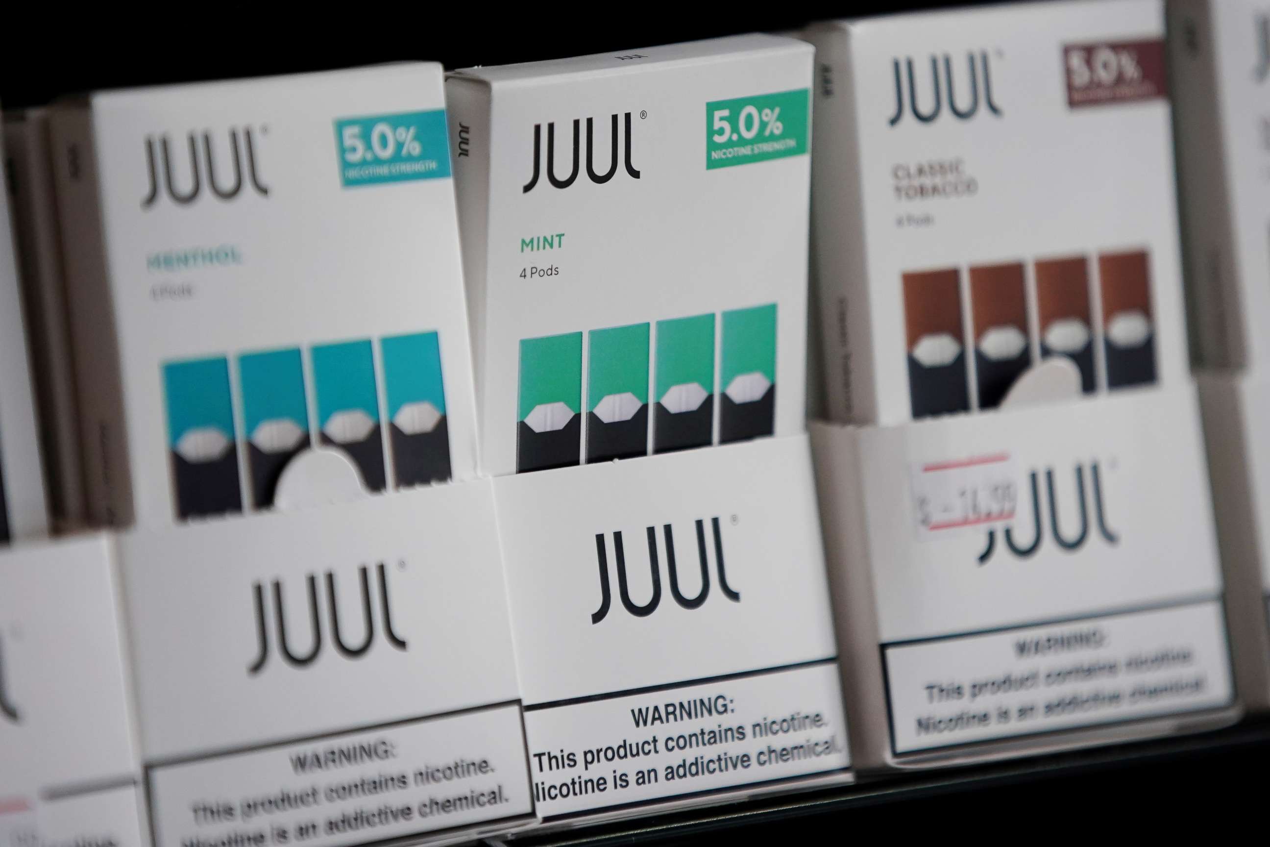 PHOTO: FILE PHOTO: Juul brand vape cartridges are pictured for sale at a shop in Atlanta, Georgia, U.S., September 26, 2019. Picture taken September 26, 2019. REUTERS/Elijah Nouvelage/File Photo