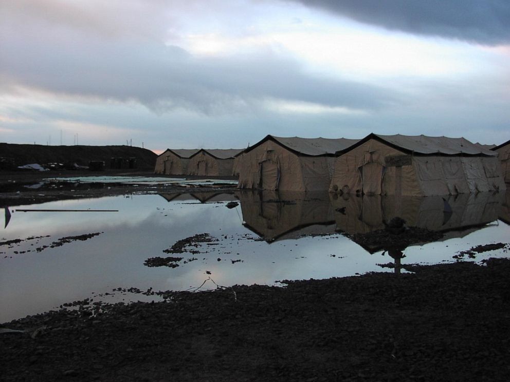 PHOTO: The area outside the communications base at Karshi-Khanabad in Uzbekistan flooded after a storm in March 2002, which brought contamination to the surface.