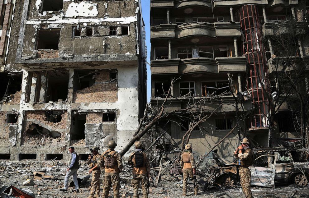 PHOTO: Afghan security force members inspect at the site of an attack in Kabul, capital of Afghanistan, July 29, 2019.