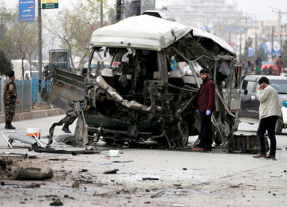 PHOTO: Afghan officials inspect a damaged minibus after a blast in Kabul, Afghanistan, March 15, 2021.