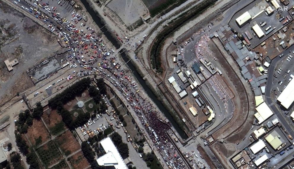 PHOTO: An overview of crowds at a gate to Kabul's airport in Afghanistan, Aug. 23, 2021, from a satellite image.
