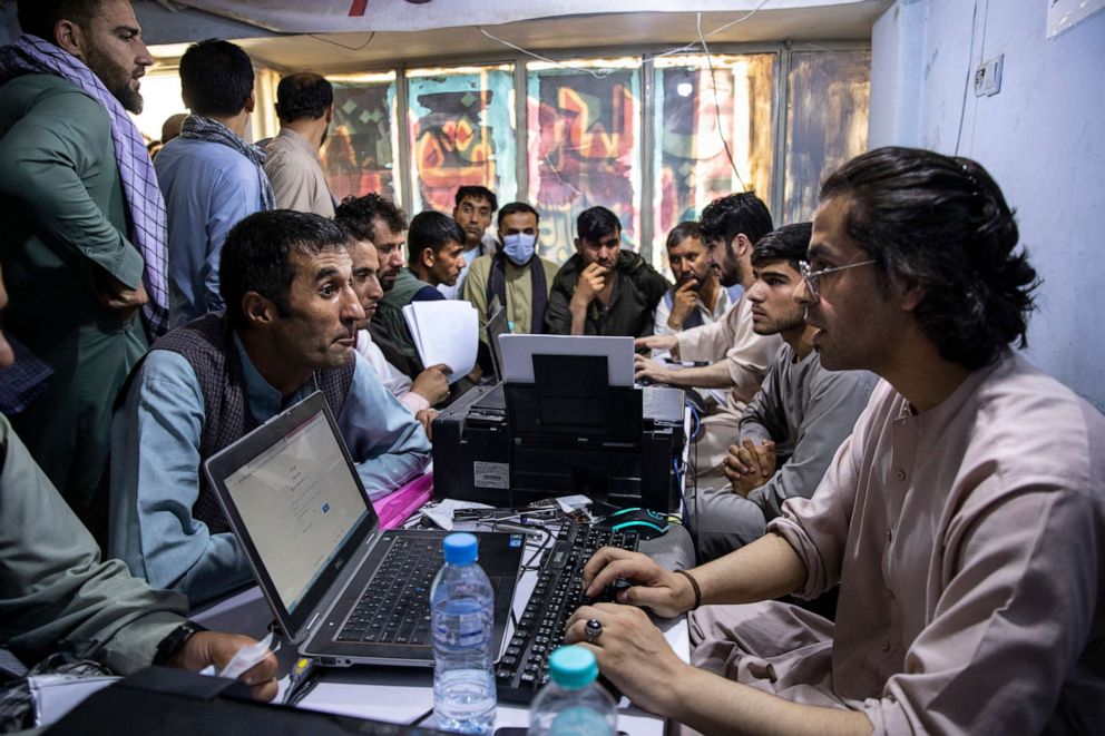 PHOTO: Afghan Special Immigrant Visa (SIV) applicants crowd into the Herat Kabul Internet cafe to apply for the SIV program on Aug. 8, 2021, in Kabul, Afghanistan.