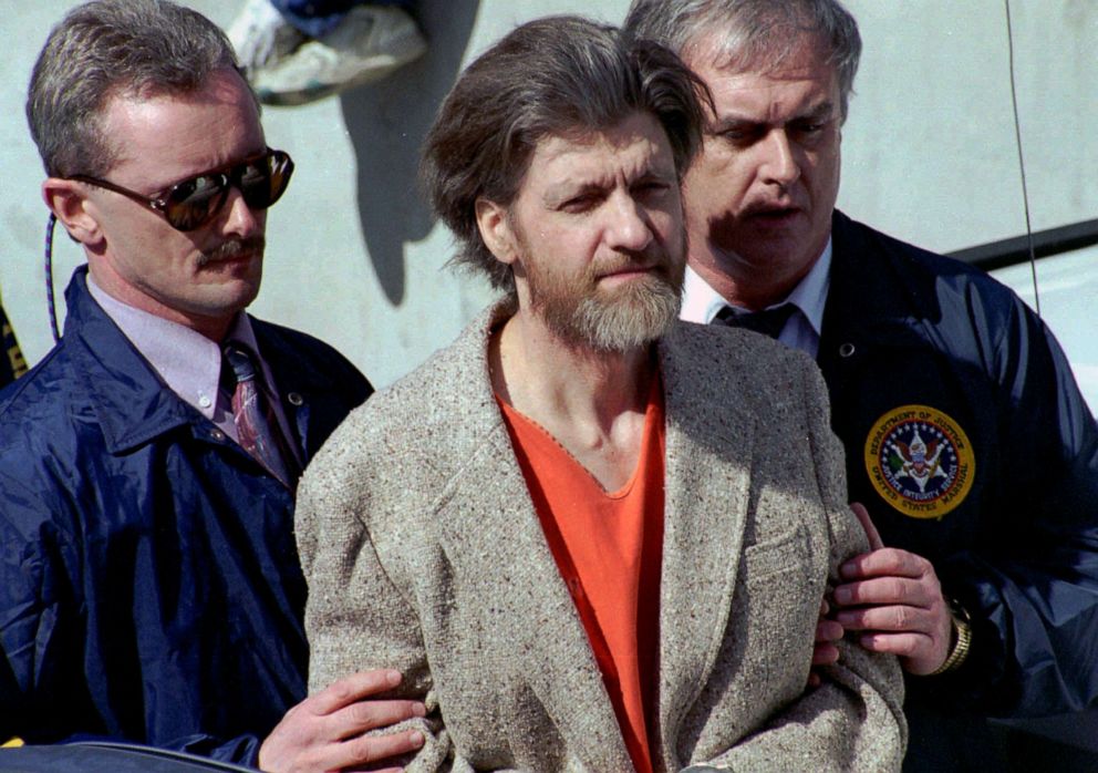 PHOTO: Ted Kaczynski, known as the Unabomber, is flanked by federal agents as he is led to a car from the federal courthouse in Helena, Mont., April 4, 1996.