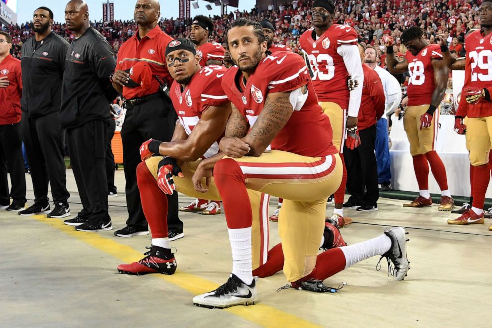 PHOTO: Colin Kaepernick #7 and Eric Reid #35 of the San Francisco 49ers kneel in protest during the national anthem prior to playing the Los Angeles Rams in their NFL game at Levi's Stadium on September 12, 2016 in Santa Clara, California.