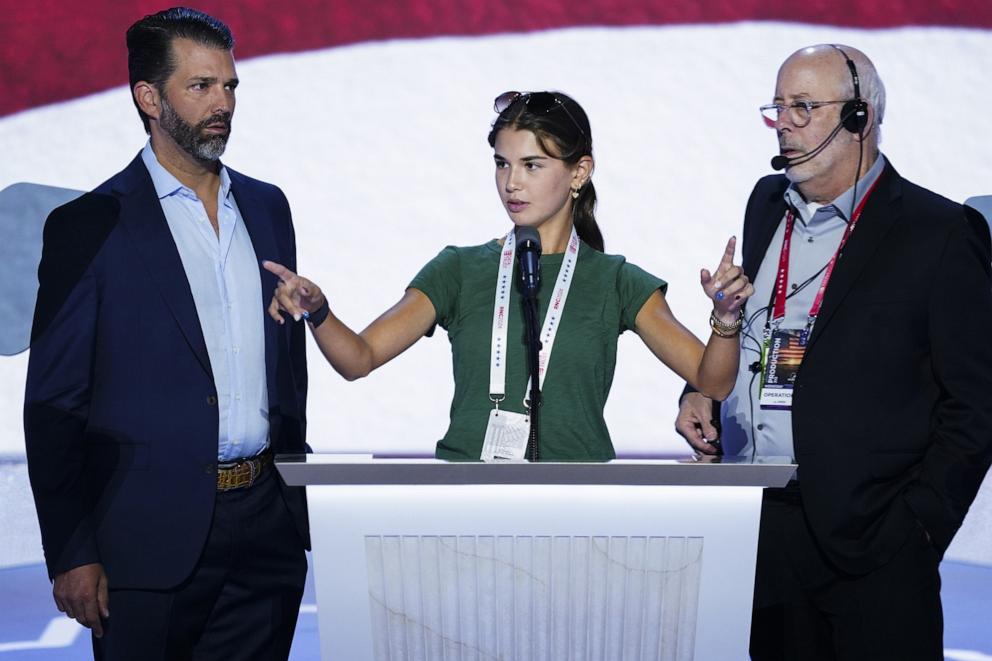PHOTO: Kai Trump and her father Donald Trump Jr. participate in a walkthrough on stage prior to the third day of the Republican National Convention (RNC) in the Fiserv Forum in Milwaukee, Wisconsin, on July 17, 2024.