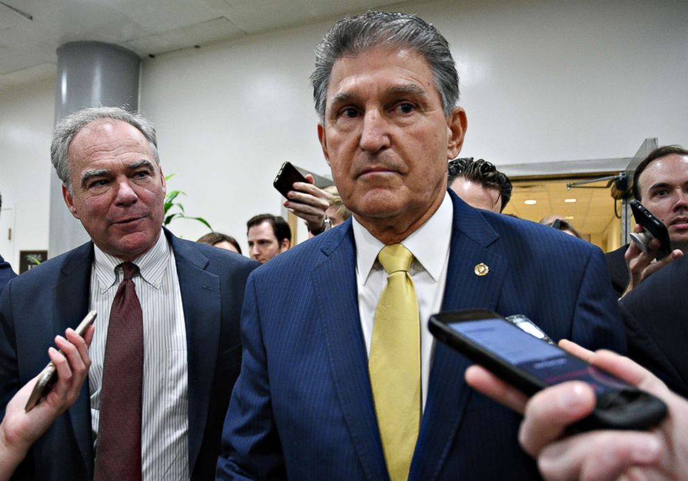 PHOTO: Senators Tim Kaine and Joe Manchin arrive at the U.S. Senate for a procedural vote on the Supreme Court nomination of Judge Brett Kavanaugh in Washington, Oct. 5, 2018.  