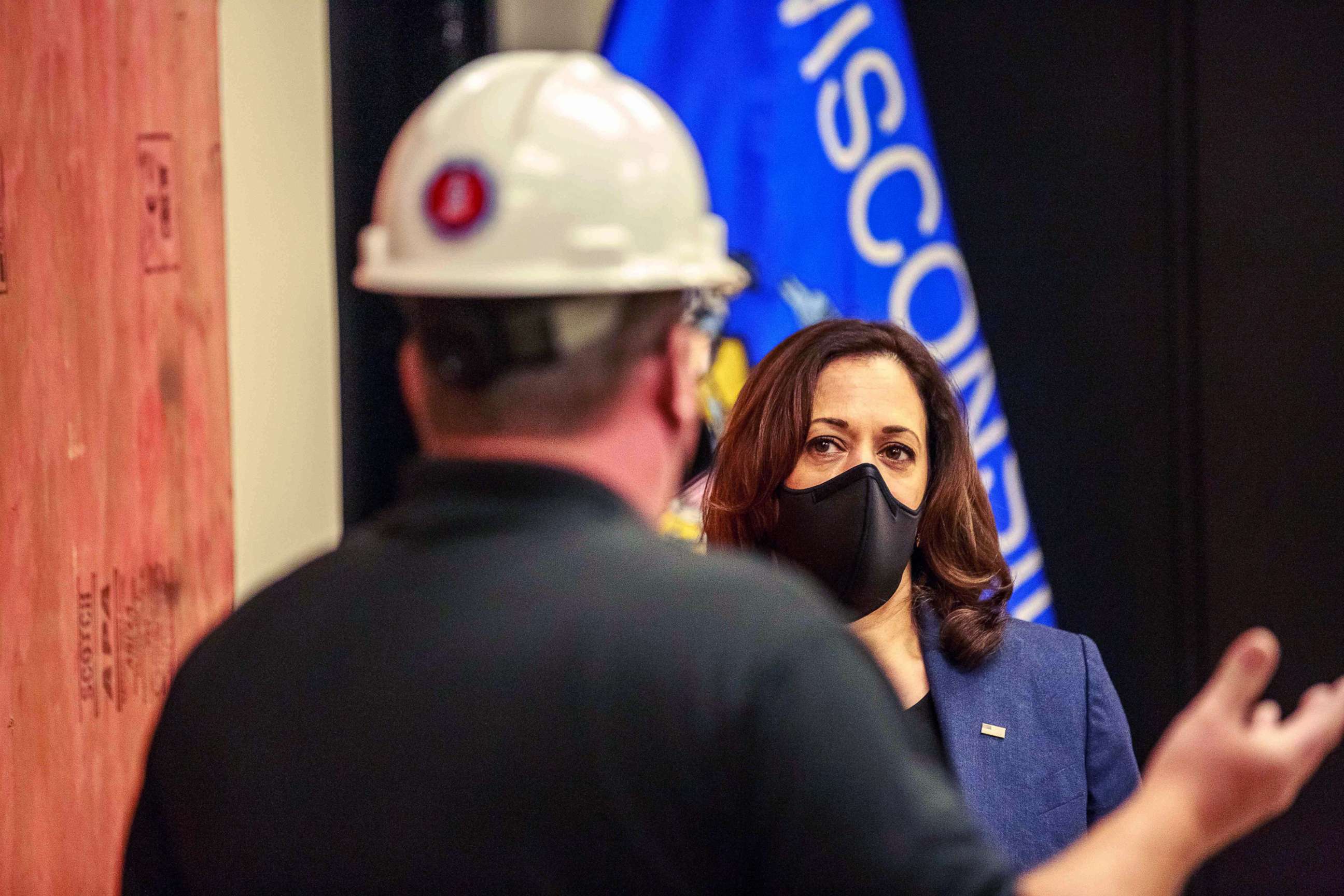 PHOTO: Democratic vice presidential nominee Kamala Harris listens to a worker as she tours an International Brotherhood of Electrical Workers (IBEW) training facility, Sept. 7, 2020, in Milwaukee.