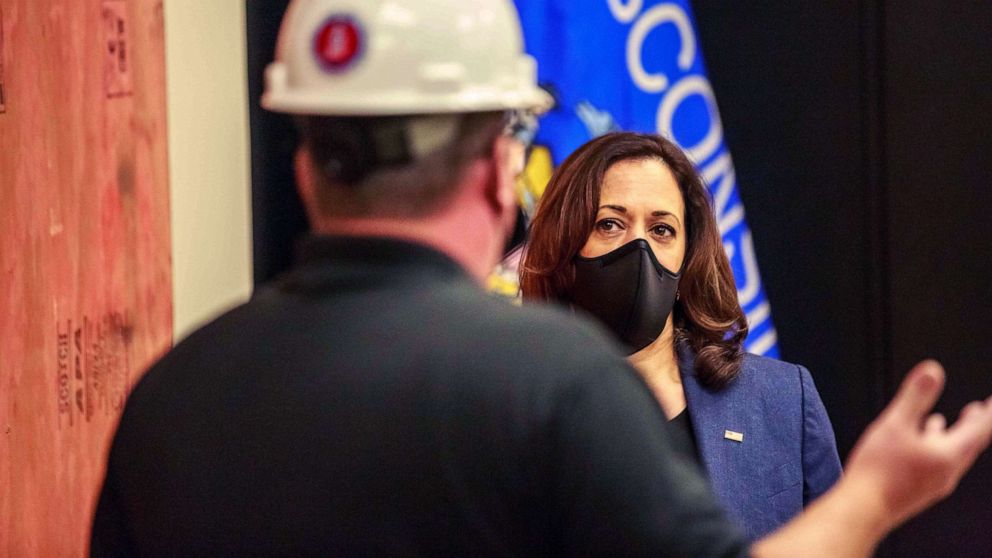 PHOTO: Democratic vice presidential nominee Kamala Harris listens to a worker as she tours an International Brotherhood of Electrical Workers (IBEW) training facility, Sept. 7, 2020, in Milwaukee.