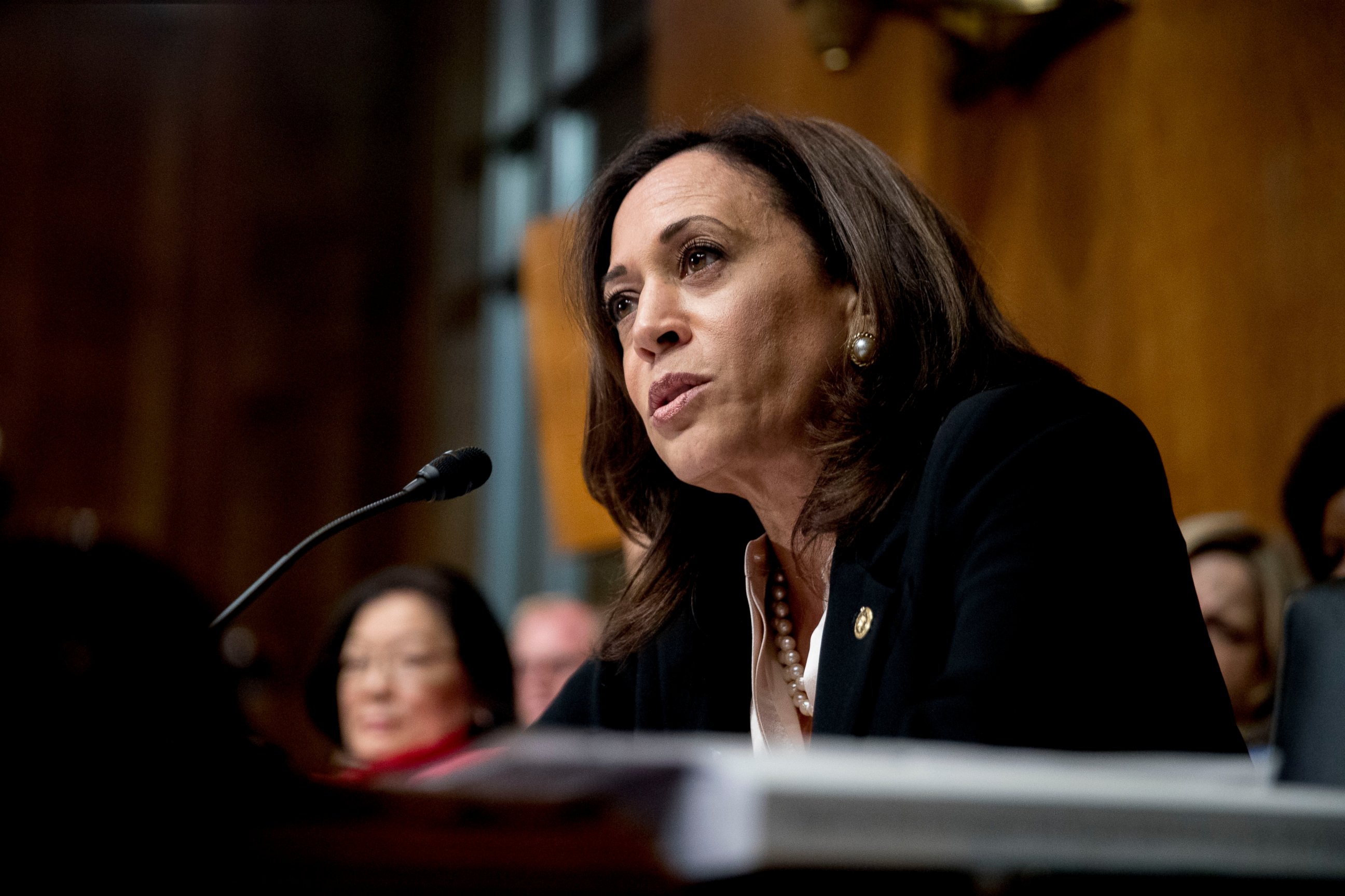 PHOTO: Sen. Kamala Harris peaks as Attorney General William Barr testifies during a Senate Judiciary Committee hearing on the Mueller Report on Capitol Hill in Washington, May 1, 2019.