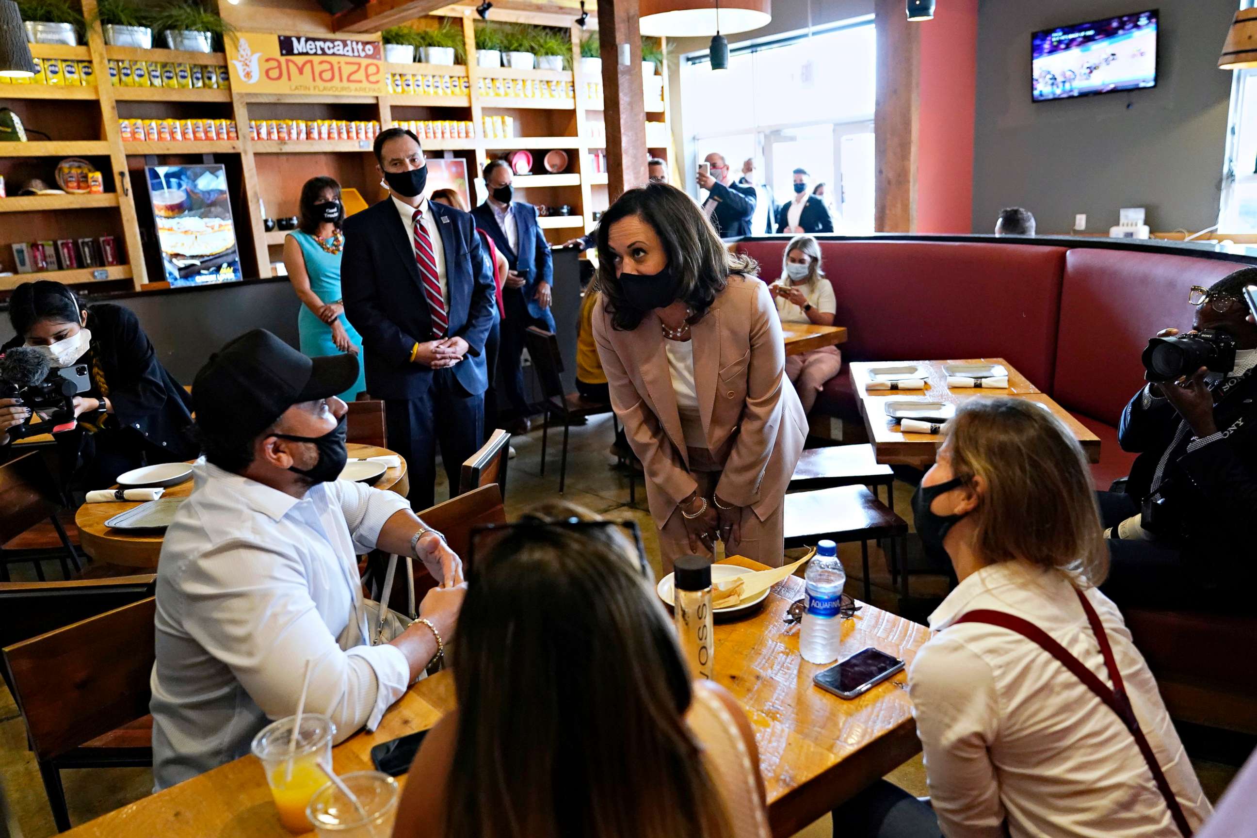 PHOTO: Democratic vice presidential candidate Sen. Kamala Harris meets with people at Amaize restaurant, Sept. 10, 2020, in Doral, Fla.