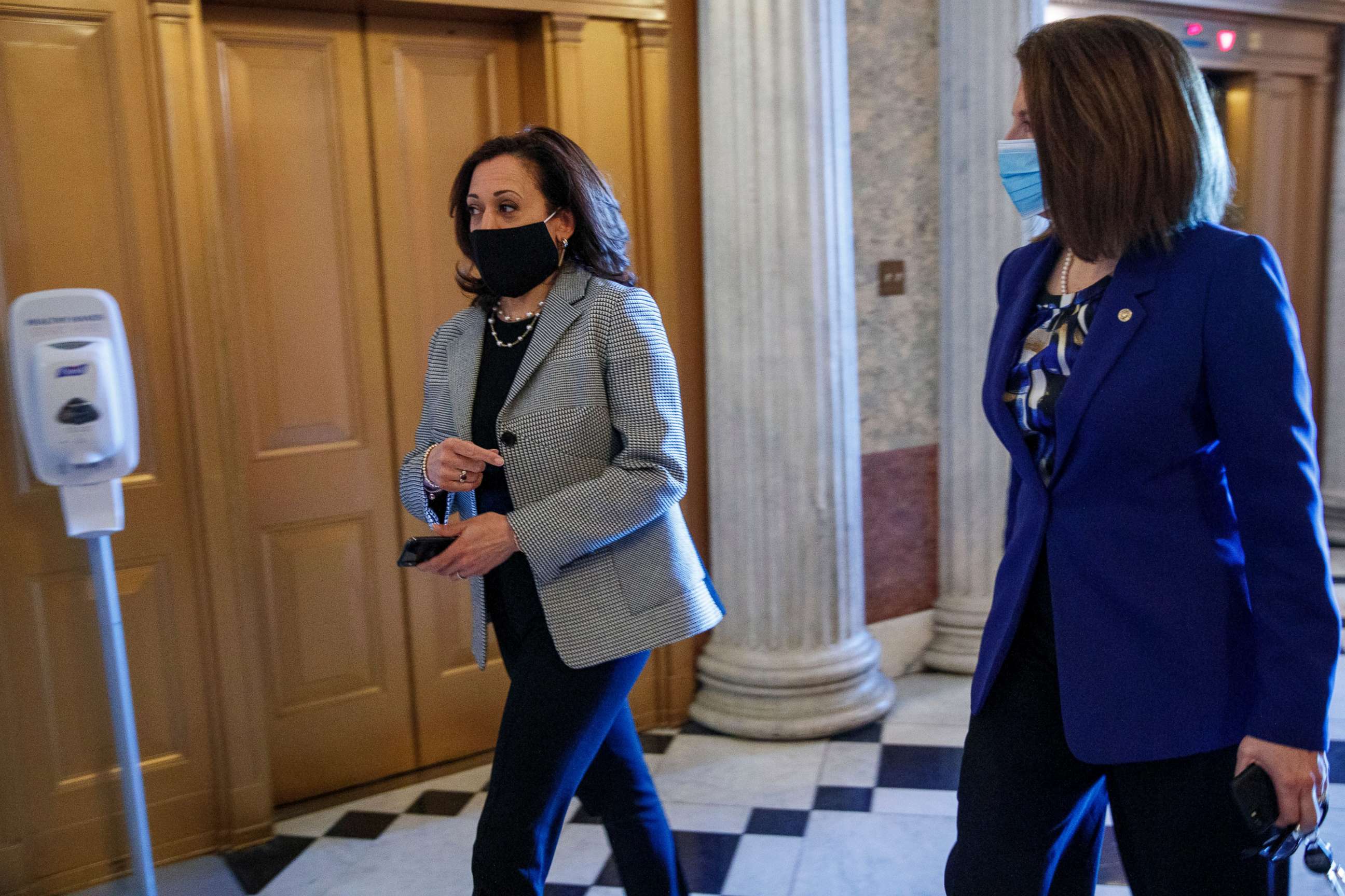 PHOTO: Sen. Kamala Harris and Sen. Catherine Cortez Masto, right, walk to the Senate floor for a vote during the COVID-19 coronavirus pandemic at the US Capitol, May 13, 2020, in Washington.