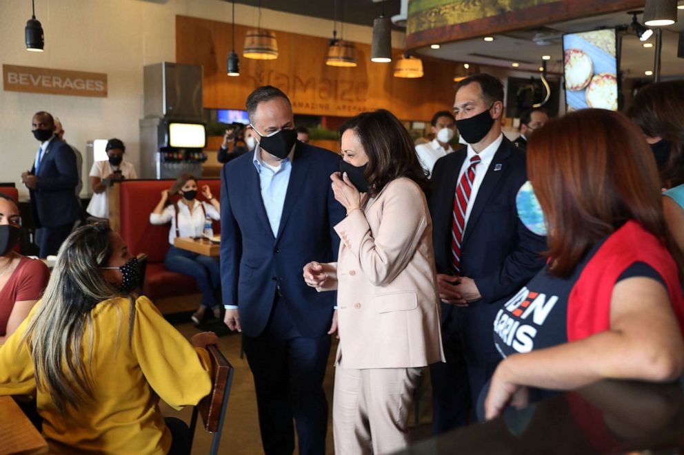 PHOTO: Democratic Vice Presidential Nominee Sen. Kamala Harris and her husband, Doug Emhoff greet people during a stop at Amaize restaurant on Sept. 10, 2020, in Doral, Fla.