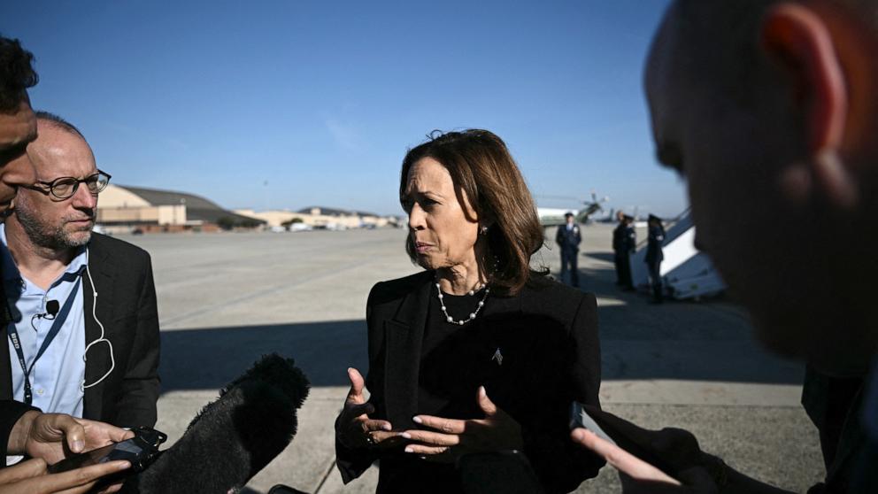 PHOTO: Vice President and Democratic presidential nominee Kamala Harris talks to reporters before boarding Air Force Two at Joint Base Andrews in Maryland on October 30, 2024.