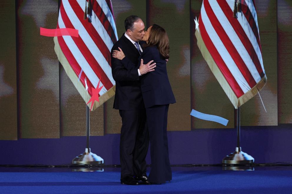 PHOTO: Democratic presidential nominee and U.S. Vice President Kamala Harris embraces her husband, second gentleman of the U.S. Doug Emhoff, following her acceptance speech on Day 4 of the Democratic National Convention, Aug. 22, 2024.