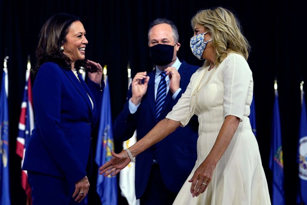 PHOTO: Sen. Kamala Harris and her husband Douglas Emhoff greet Jill Biden, wife of Democratic presidential candidate former Vice President Joe Biden, after a campaign event at Alexis Dupont High School in Wilmington, Del., Aug. 12, 2020.