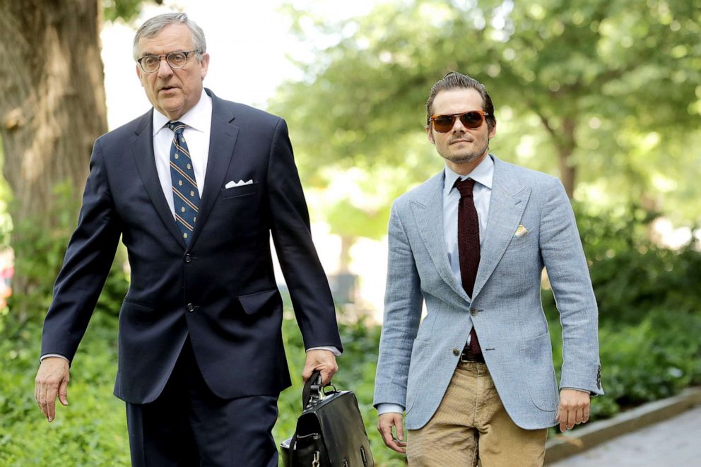 PHOTO: Andrew Miller (right), a former aide to political operative Roger Stone, and his lawyer Paul Kamenar arrive at the Prettyman U.S. Court House, May 31, 2019 in Washington, D.C.