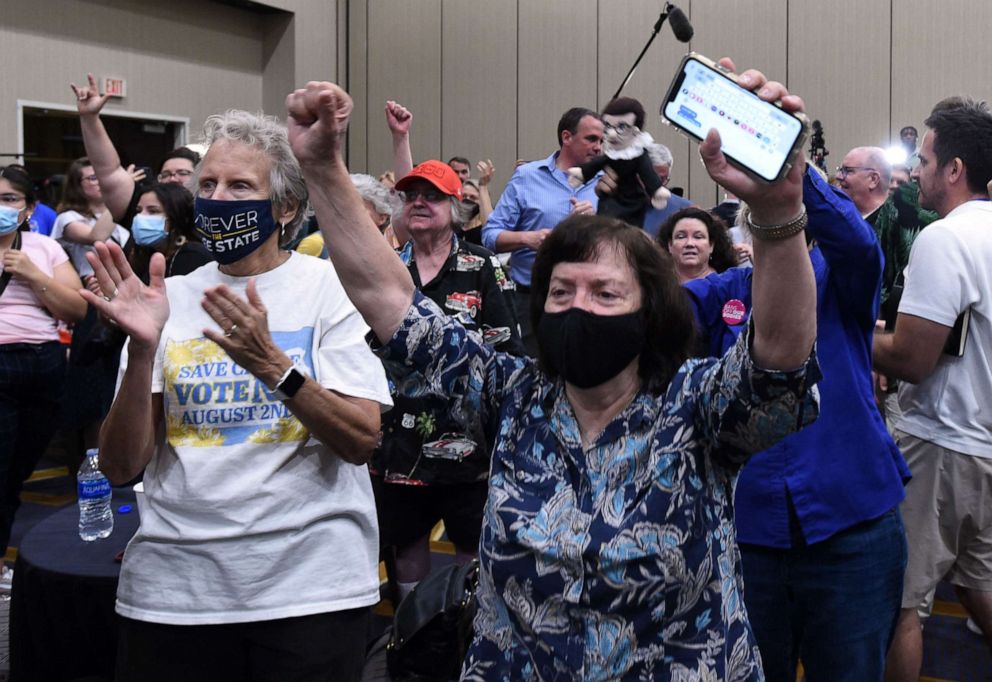 PHOTO: Supporters cheer, as the proposed Kansas Constitutional amendment fails, as they watch the call from the networks during Kansas for Constitutional Freedom primary election watch party in Overland Park, Kansas, August 2, 2022.