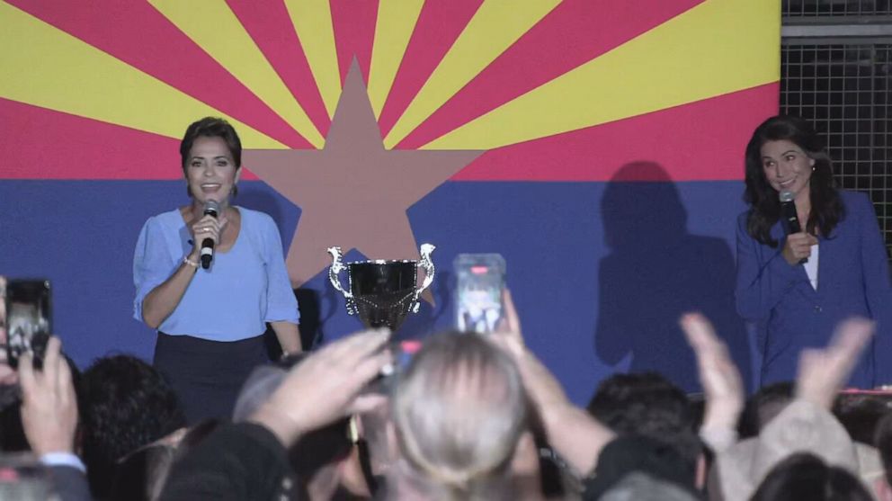 PHOTO: Tulsi Gabbard and Kari Lake appear onstage together at a campaign event for Kari Lake in Arizona, on Oct. 18, 2022.