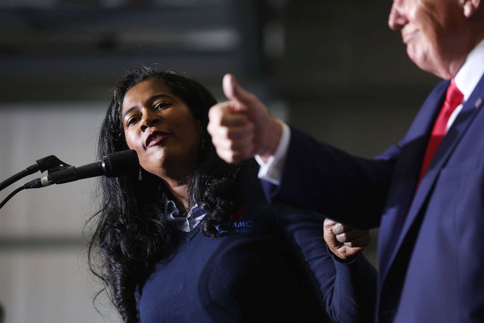 PHOTO: Kristina Karamo, running for the Michigan Republican party's nomination for secretary of state, gets an endorsement from former President Donald Trump during a rally on April 2, 2022, near Washington, Mich.