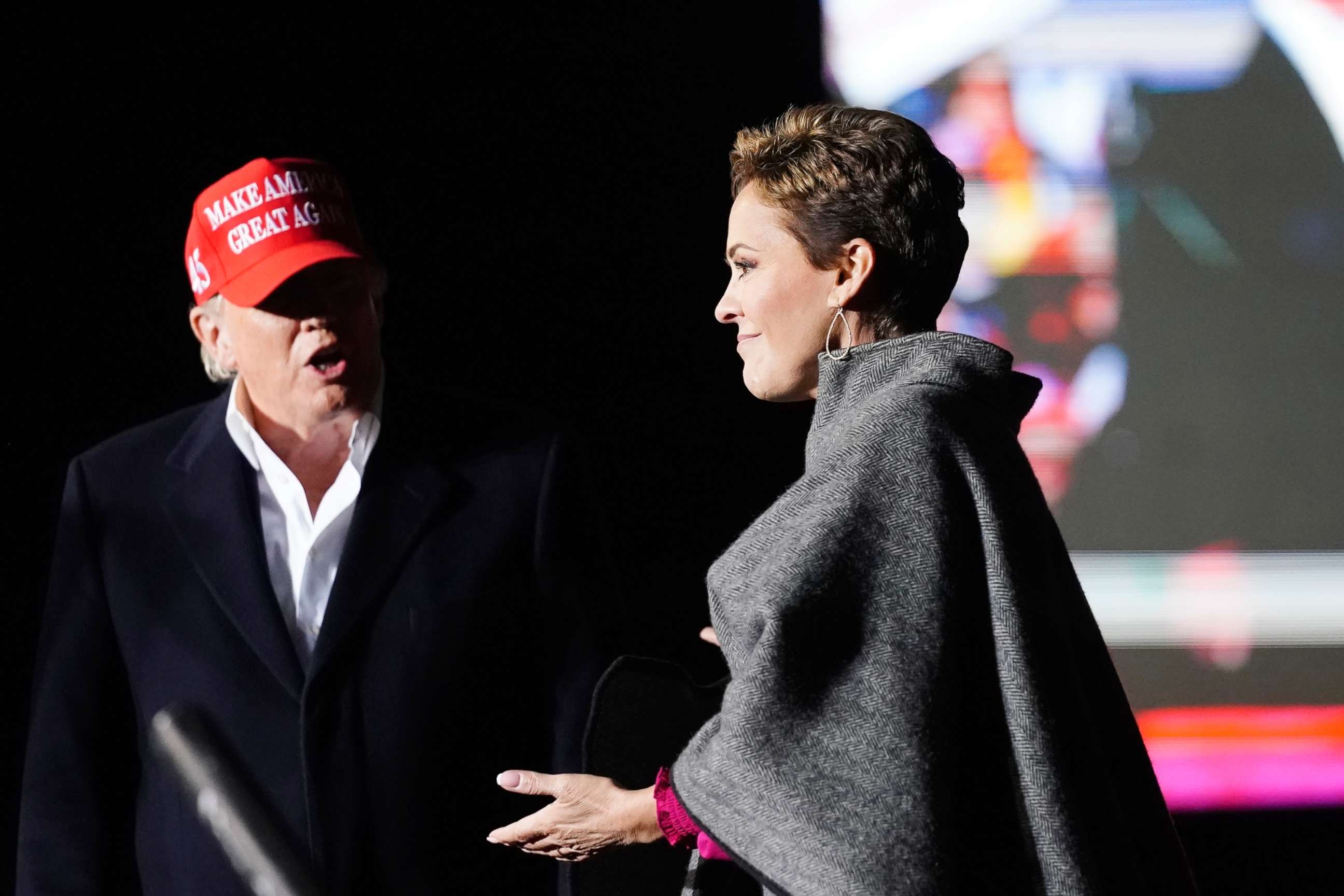 PHOTO: Former President Donald Trump, left, introduces Arizona Republican candidate for governor Kari Lake, right, as Trump speaks at a rally on Jan. 15, 2022, in Florence, Ariz.