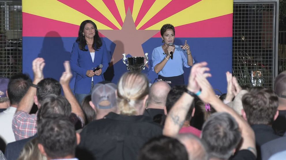 PHOTO: Tulsi Gabbard and Kari Lake appear onstage together at a campaign event for Kari Lake in Arizona, on Oct. 18, 2022.