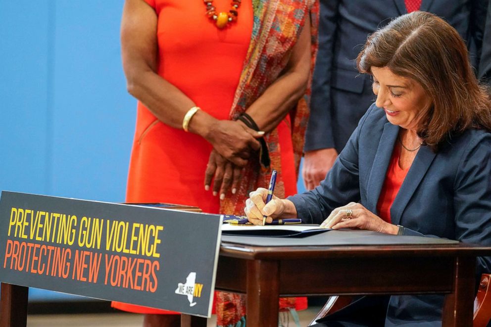 PHOTO: New York Gov. Kathy Hochul signs a package of bills to strengthen gun laws, June 6, 2022, in New York.