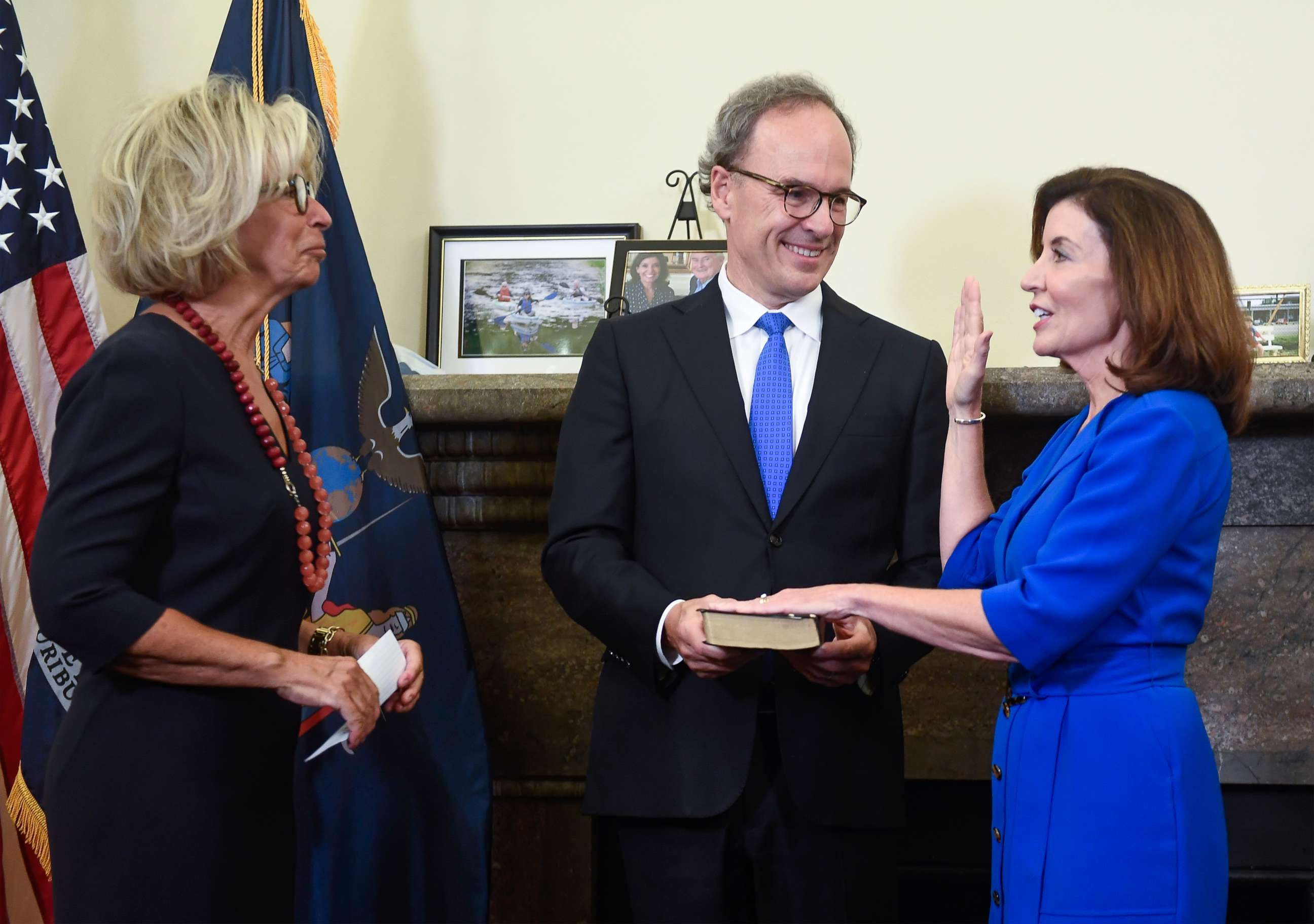 PHOTO: New York Chief Judge Janet DiFiore, left, swears in Kathy Hochul, right, as the first woman to be New York's governor while her husband Bill Hochul holds a bible in the Red Room at the state Capitol, Tuesday, Aug. 24, 2021, in Albany, N.Y.