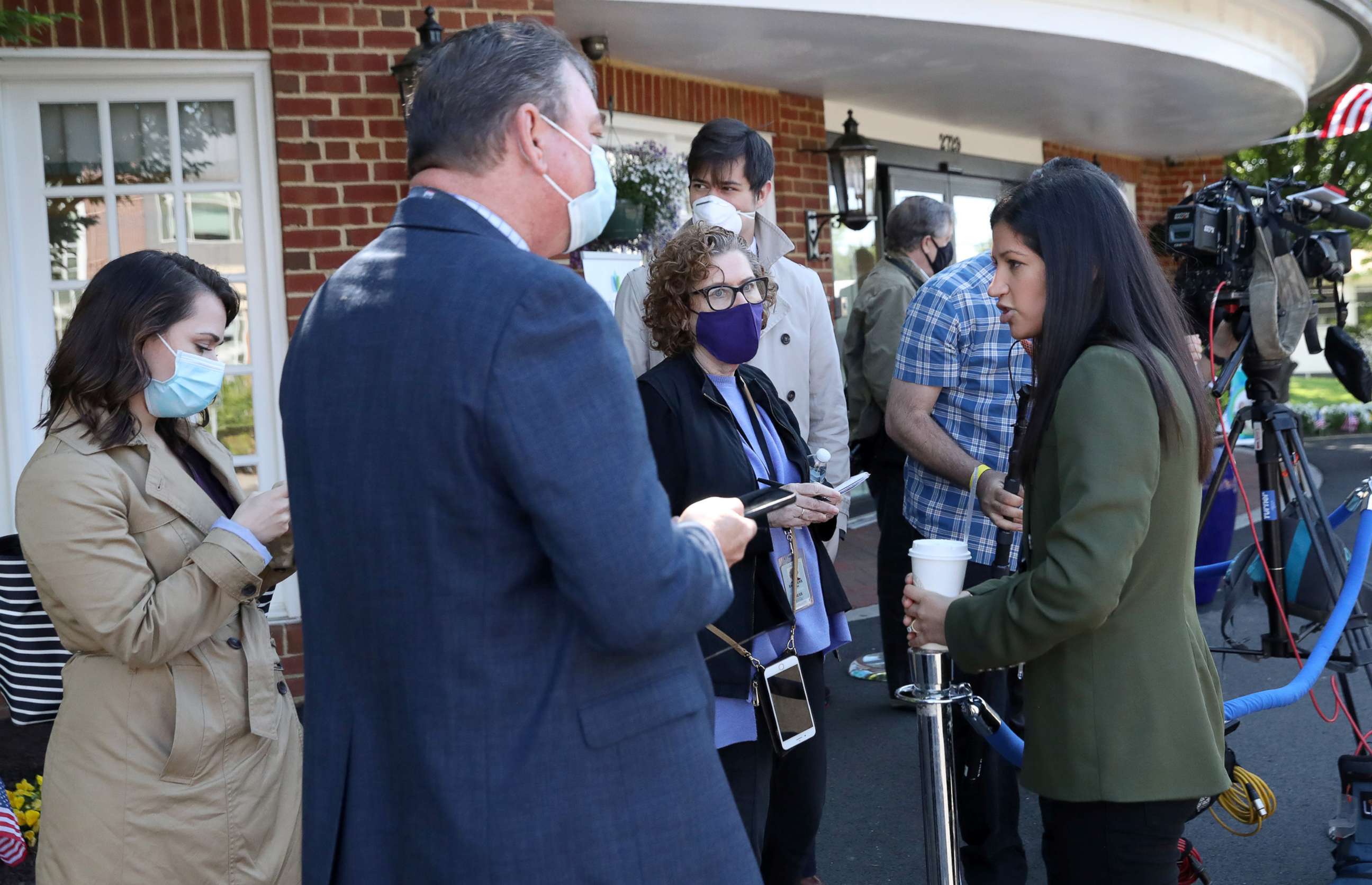 PHOTO: Katie Miller, Press Secretary for Vice President Mike Pence, right, speaks with reporters before an event featuring Pence delivering a shipment of PPE to the Woodbine Rehabilitation and Healthcare Center in Alexandria, Va., May 7, 2020.