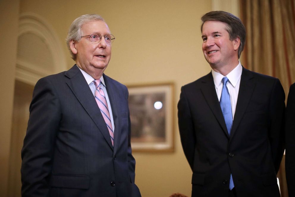 PHOTO: Senate Majority Leader Mitch McConnell (R-KY) (L) makes brief remarks before meeting with Judge Brett Kavanaugh in McConnell's office at the Capitol, July 10, 2018.