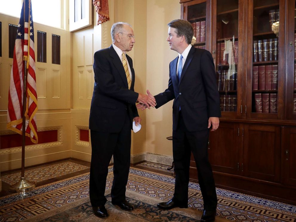 PHOTO: Senate Judiciary Committee Chairman Charles Grassley (R-IA) (L) shakes hands with Judge Brett Kavanaugh after a meeting at the Capitol, July 10, 2018.