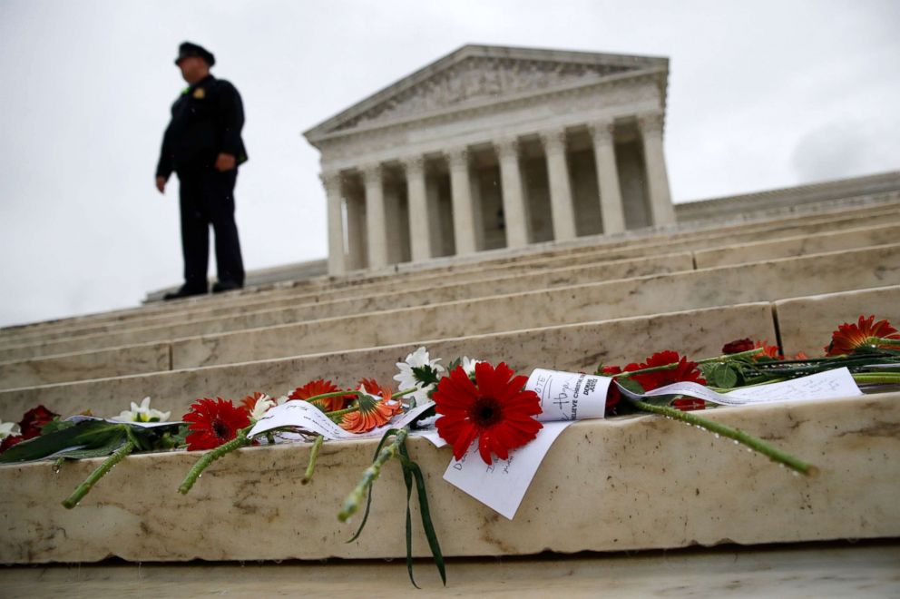 PHOTO: Flowers and notes left behind by protesters opposing Supreme Court nominee Brett Kavanaugh rest on the Supreme Court steps on Capitol Hill in Washington, Sept. 27, 2018.