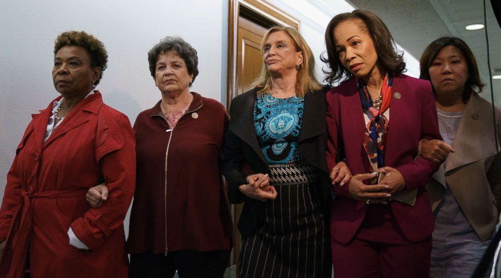 PHOTO: Women members of congress link arms as they walk together and to enter a Senate Judiciary Committee hearing on Judge Brett Kavanaugh, Sept. 28, 2018. 