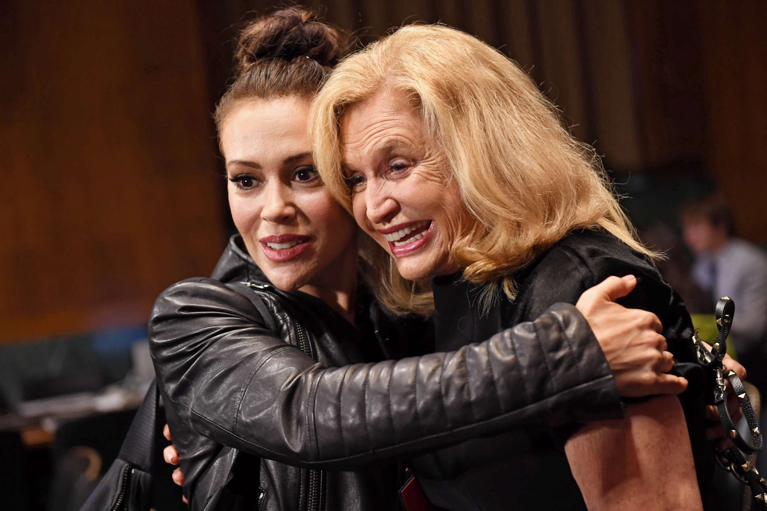 PHOTO: Actress Alyssa Milano hugs Rep. Carolyn Maloney in the hearing room prior to the Senate Judiciary Committee hearing on the nomination of Brett Kavanaugh on Capitol Hill in Washington, Sept. 27, 2018.