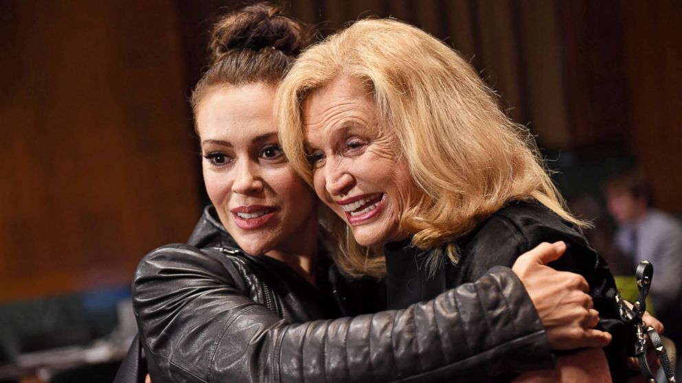 PHOTO: Actress Alyssa Milano hugs Rep. Carolyn Maloney in the hearing room prior to the Senate Judiciary Committee hearing on the nomination of Brett Kavanaugh on Capitol Hill in Washington, Sept. 27, 2018.