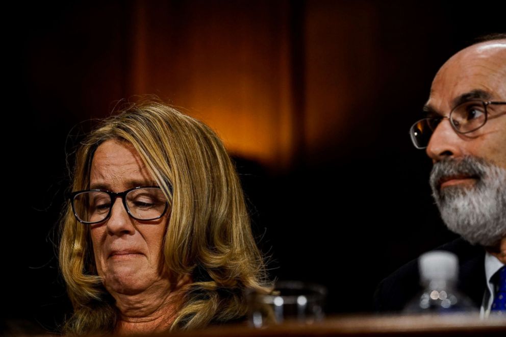 PHOTO: Christine Blasey Ford, sitting next to one of her lawyers, Michael R. Bromwich,  tears up during a Senate Judiciary Committee hearing on Capitol Hill, Sept. 27, 2018 in Washington.