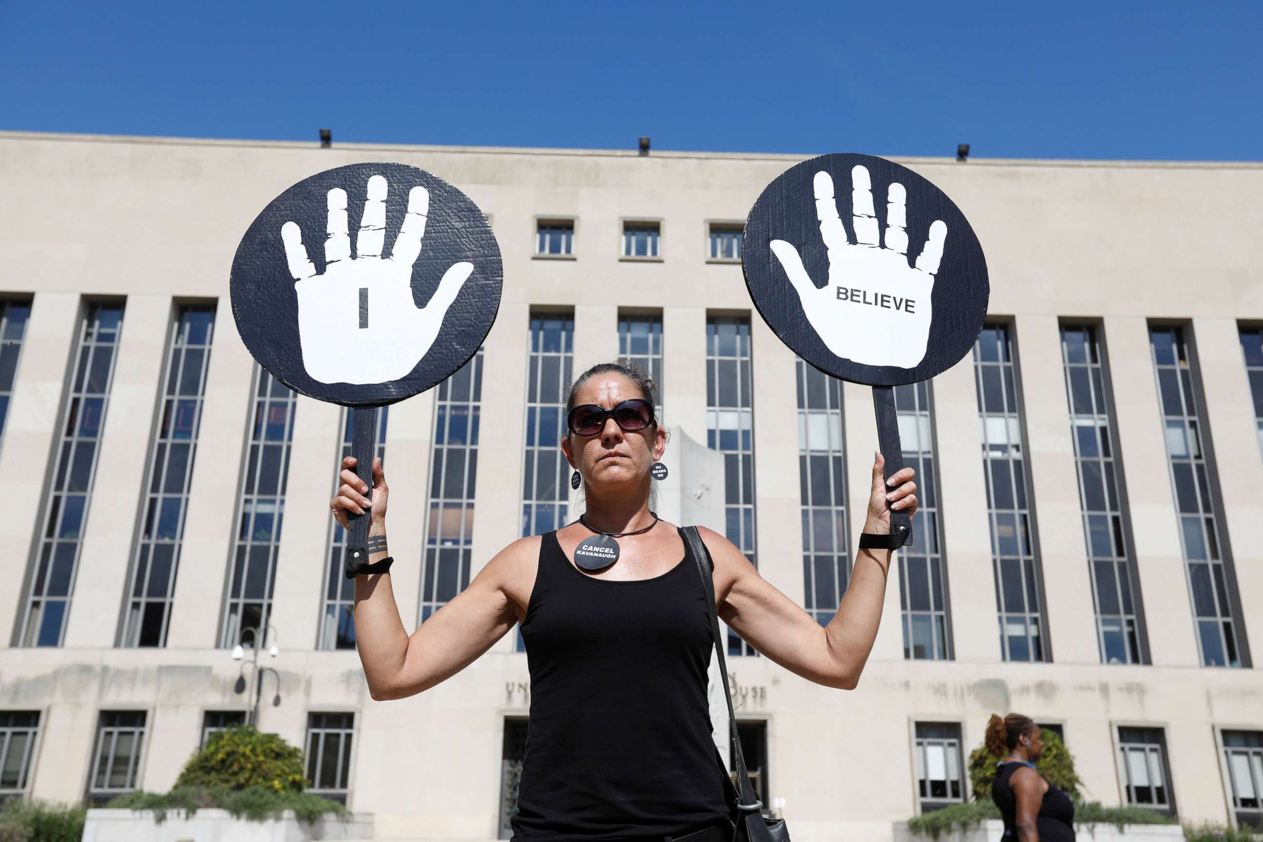 PHOTO: An woman expresses support for Christine Blasey Ford, the university professor who has accused U.S. Supreme Court nominee Brett Kavanaugh of sexual assault in 1982voutside U.S. District Court in Washington, Oct. 4, 2018.