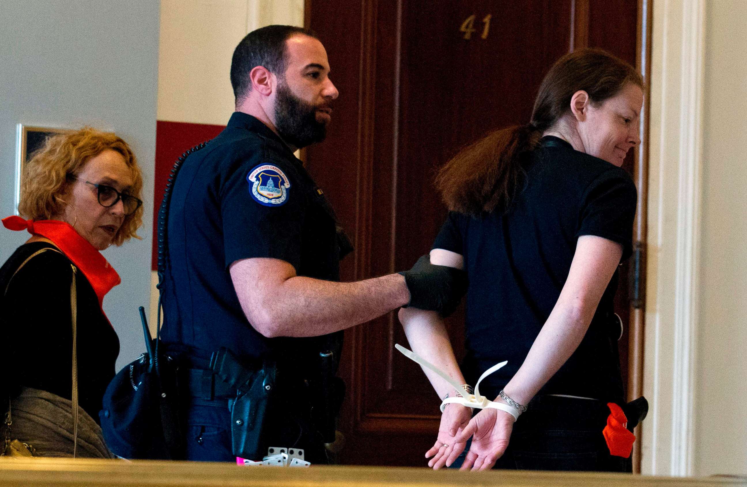 PHOTO: Protesters against Supreme Court nominee Brett Kavanaugh are arrested after blocking the office of Sen. Jeff Flakes, Republican of Arizona, in Washington on Oct. 5, 2018. 