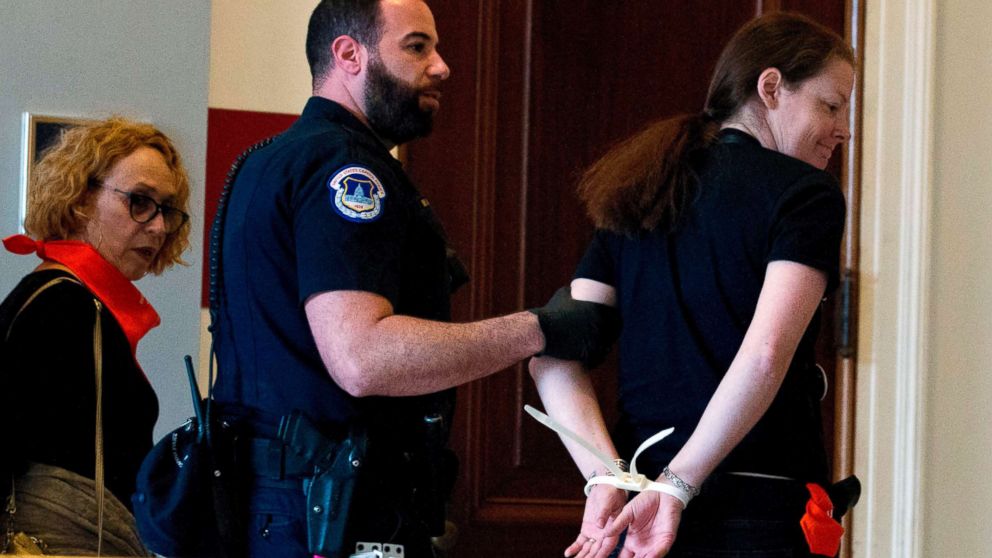 PHOTO: Protesters against Supreme Court nominee Brett Kavanaugh are arrested after blocking the office of Sen. Jeff Flakes, Republican of Arizona, in Washington on Oct. 5, 2018. 