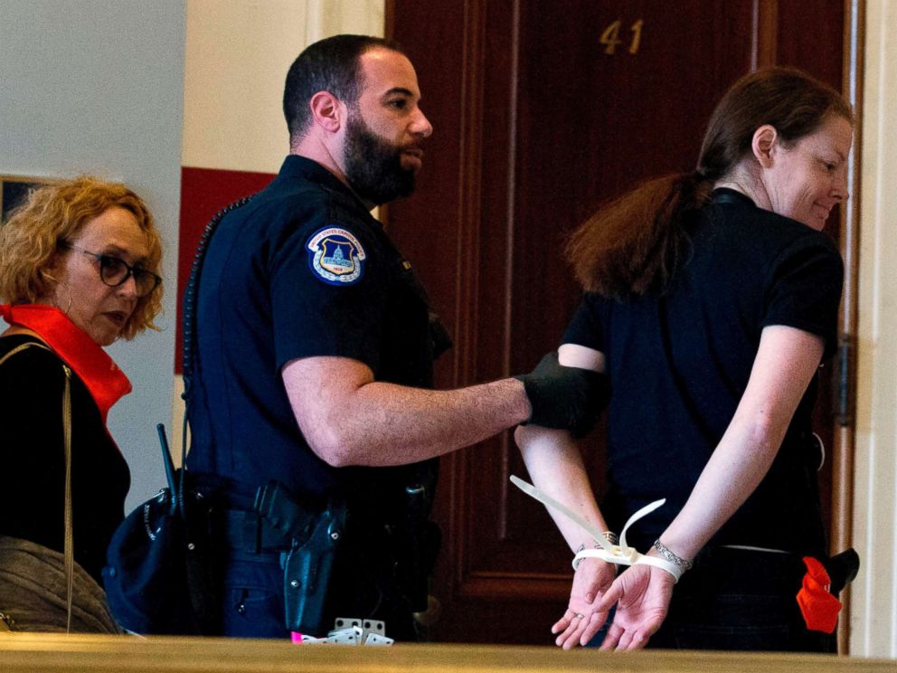 PHOTO: Protesters against Supreme Court nominee Brett Kavanaugh are arrested after blocking the office of Sen. Jeff Flakes, Republican of Arizona, in Washington on Oct. 5, 2018.