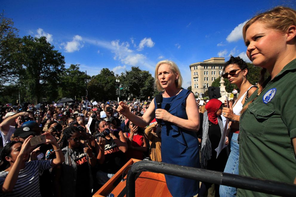 PHOTO: Sen. Kirsten Gillibrand, D-N.Y., with actress and comedian Amy Schumer, right, speaks at a rally against Supreme Court nominee Brett Kavanaugh at the Supreme Court in Washington, Oct. 4, 2018. 